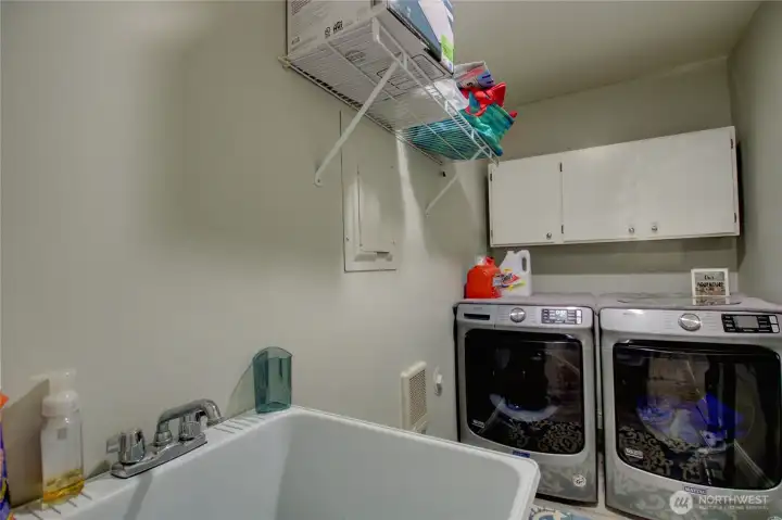 Laundry room with Stainless Steel Maytag washer and dryer.