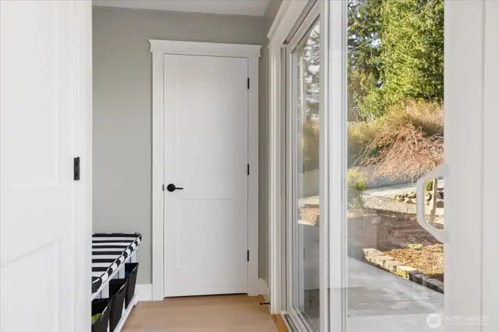 Door to basement is at left, slider at right exits to back patio