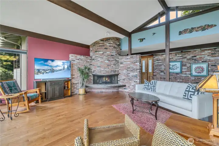 Living Room with rounded brick gas fireplace.