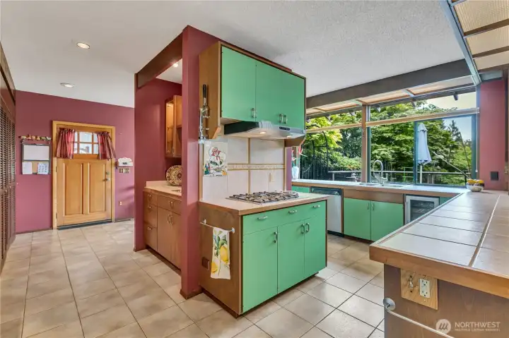 Spacious Kitchen with door leading to the garage.