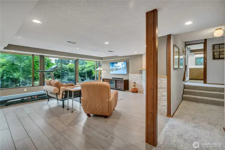 Lower-level family room with updated flooring and new carpet.