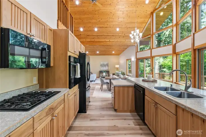 Open sightlines from the kitchen to the dining and living areas support both entertaining and everyday convenience. Open sightlines from the kitchen to the dining and living areas support both entertaining and everyday convenience.