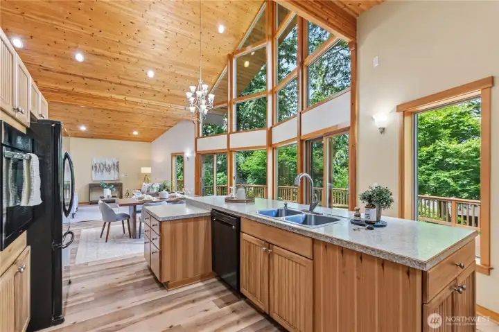 Functional kitchen design includes ample storage, generous work surfaces, and easy access to the adjoining dining and living areas. Functional kitchen design includes ample storage, generous work surfaces, and easy access to the adjoining dining and living areas.