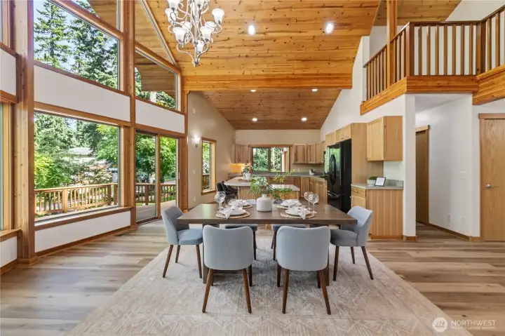 The dining area offers direct access to the expansive deck, extending living and entertaining opportunities outdoors. The dining area offers direct access to the expansive deck, extending living and entertaining opportunities outdoors.