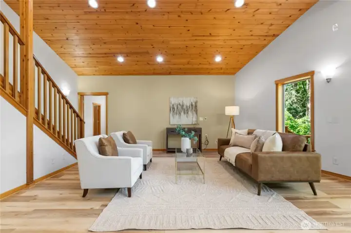 Warm wood finishes, vaulted ceilings, and oversized windows add character and architectural appeal throughout the main living area. Warm wood finishes, vaulted ceilings, and oversized windows add character and architectural appeal throughout the main living area.