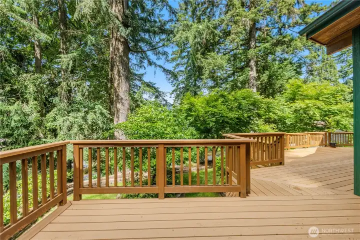 Deck nook off primary suite access - Enjoy year-round outdoor relaxation with easy access from the home and views of the surrounding landscape. Deck nook off primary suite access - Enjoy year-round outdoor relaxation with easy access from the home and views of the surrounding landscape.