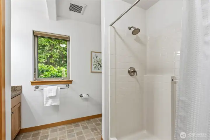 The additional bathroom includes a walk-in shower and convenient access for guests or secondary living spaces. The additional bathroom includes a walk-in shower and convenient access for guests or secondary living spaces.