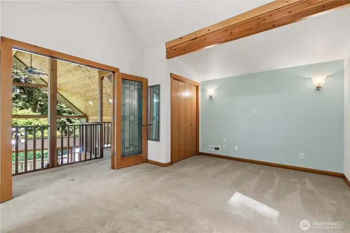An upper-level bedroom offers vaulted ceilings, natural light, and flexible space for guests, hobbies, or additional living needs. An upper-level bedroom offers vaulted ceilings, natural light, and flexible space for guests, hobbies, or additional living needs.