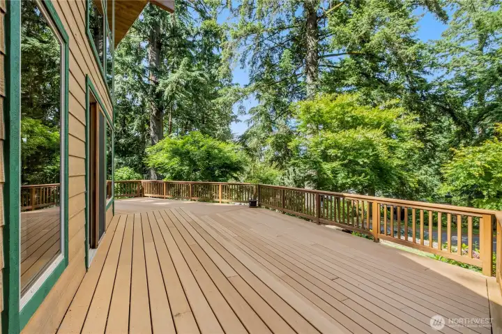 Large composite-style deck offers abundant space for outdoor dining, gatherings, and enjoying the natural surroundings. Large composite-style deck offers abundant space for outdoor dining, gatherings, and enjoying the natural surroundings.