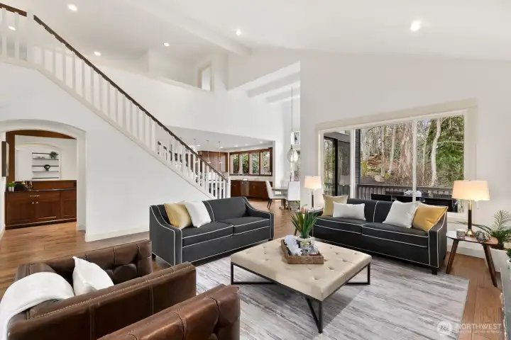Thoughtfully designed open floor plan offers exceptional flow from the living room to the gourmet kitchen and staircase, ideal for modern living and entertaining.