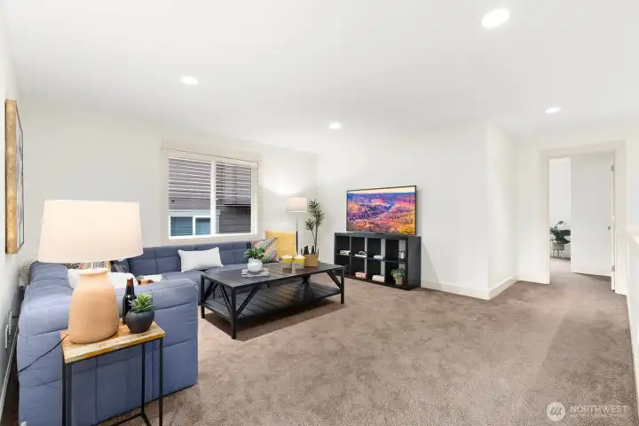 Bright and spacious bonus room with plush carpeting and flexible layout offers endless possibilities for recreation, entertainment, or remote work.