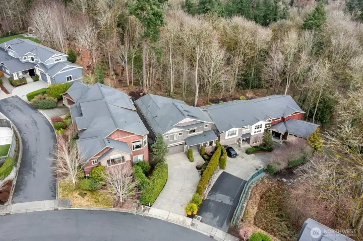 Surrounded by mature trees and established homes, offering privacy while remaining close to shopping, dining, waterfront parks, and major commuter routes.
