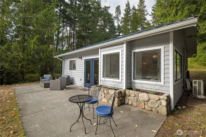 Expansive waterfront patio offers the perfect setting for outdoor dining, morning coffee, or enjoying the sights and sounds of island living.