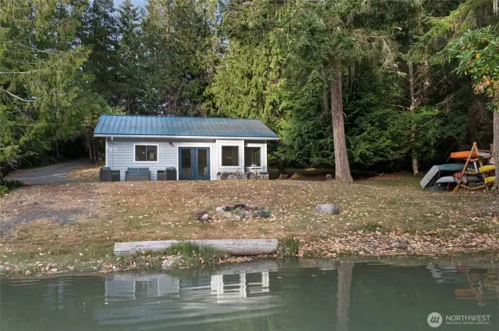 Enjoy true waterfront living with the updated cottage positioned just steps from the shoreline, offering easy access to kayaking, paddleboarding, and year-round waterfront enjoyment.