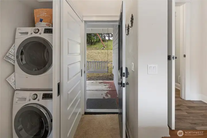 Convenient in-home laundry with stacked washer and dryer, providing efficient everyday functionality.