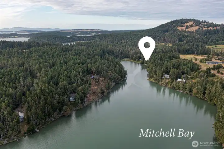 Sweeping aerial highlighting the property's location within picturesque Mitchell Bay, one of San Juan Island's most protected and scenic waterfront settings.