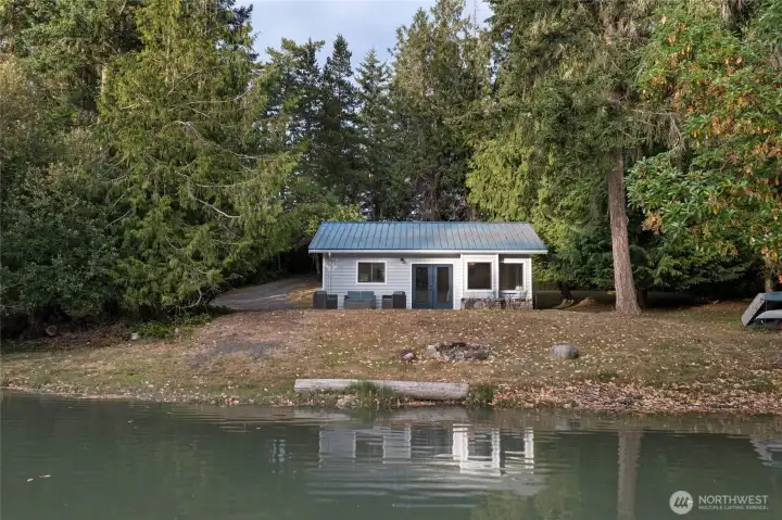 Beautifully updated waterfront cottage positioned along approximately 200 feet of Mitchell Bay shoreline, offering a peaceful setting with direct access to the water.