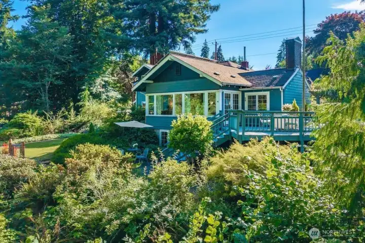Set on 1.10 acres overlooking the City & Lake sits the sweetest Craftsman Bungalow...