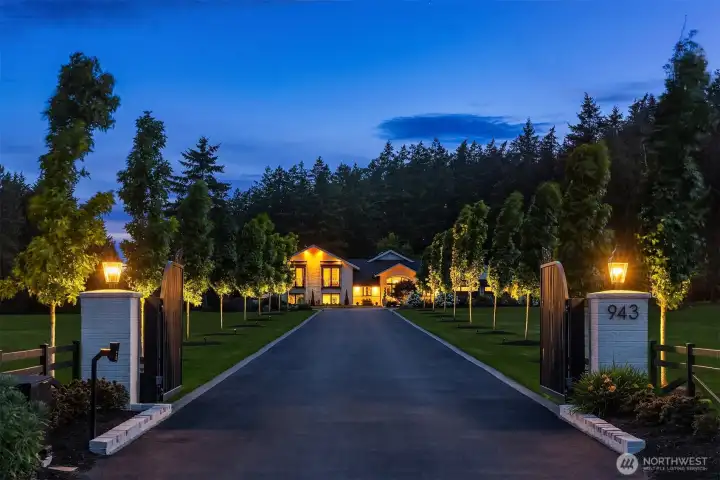 Gated entry with video intercom system.  Landscaping with integrated lighting system.