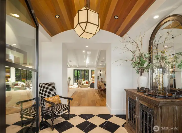 Entry features a marble and travertine floor with radiant floor heating.