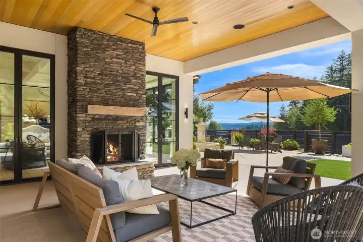 Patio with wood-burning fireplace and territorial views of the Olympic mountains.