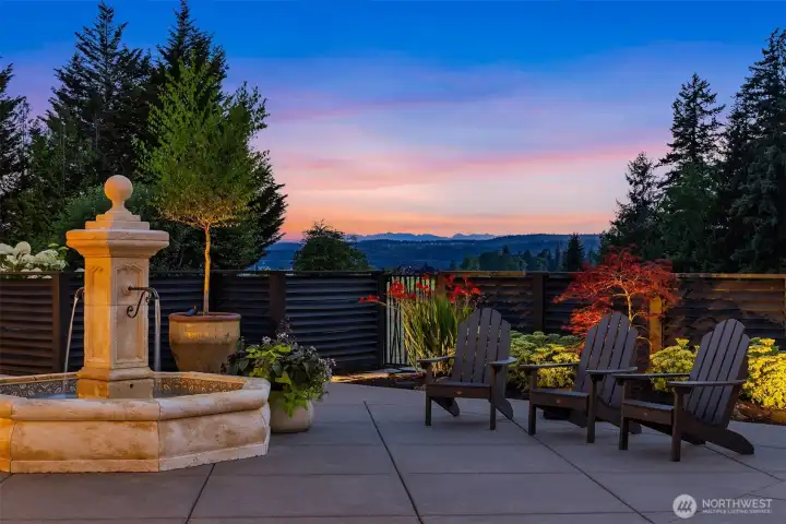 Sunsets and Olympic Mountain views bathe the courtyard in light while the extensive outdoor lighting creates a magical setting at dusk.