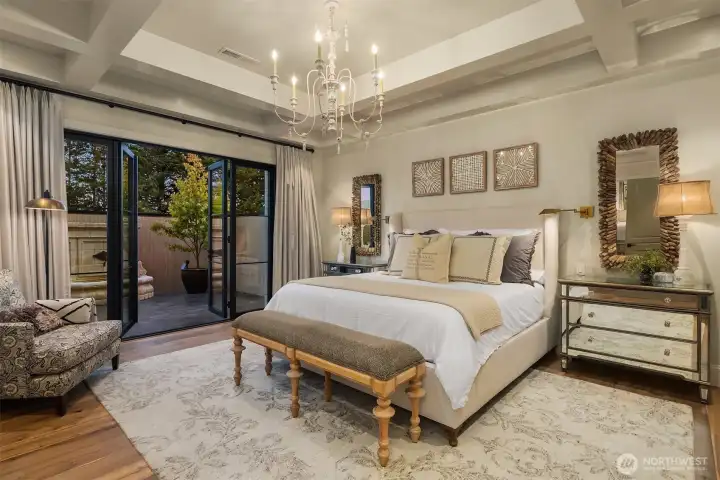 Primary bedroom is highlighted by coffered ceiling.  French doors lead to a private courtyard with fountain and is wired for a hottub.