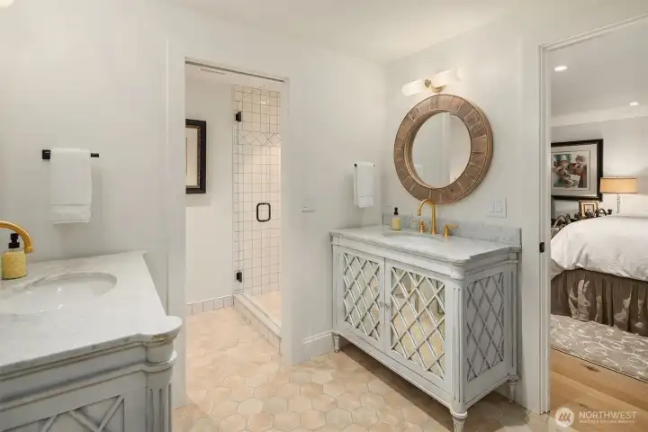 En-suite bath features two vanities, shower, and radiant floor heating.