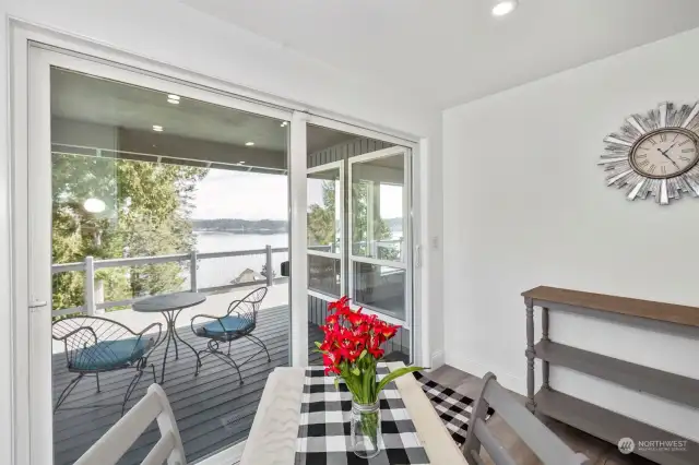 Breakfast nook area with amazing views and slider access to covered portion of deck.
