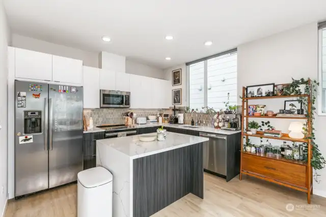 Waterfall Kitchen Island with room for sit at bar stools.