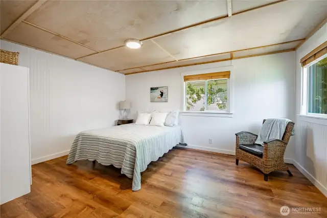 Primary bedroom is spacious with good light.