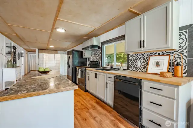 Updated kitchen with island is great space to cook.