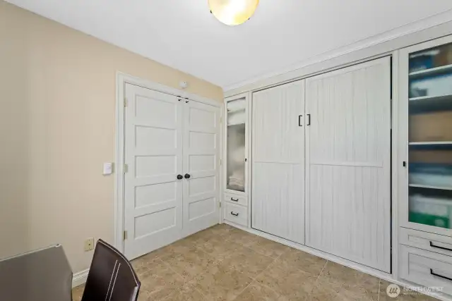 Second bedroom/office with Murphy Bed and custom cabinets