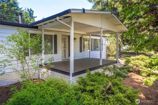Grand entrance to the home, overlooking mature shrubs and low-maintenance yard.