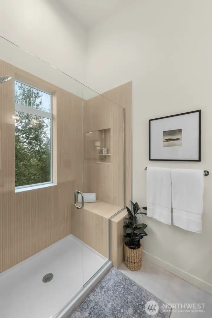 Soak your stress away in this luxurious tub surrounded by natural light and serenity.