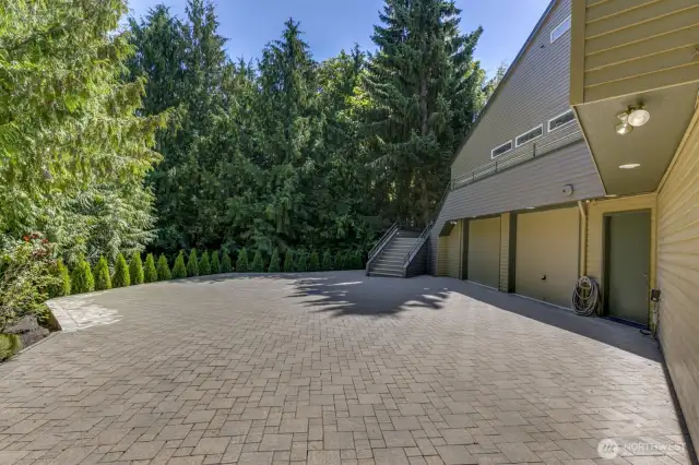 Totally private the paver driveway provides turn around space for entering the garage.