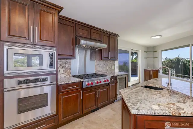 The kitchen is totally redone with new cabinets, stone counters and top of the line SS appliances.