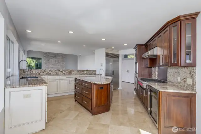 Looking through the kitchen to the living room. Note the Sub Zero refrigerator.