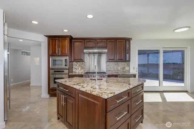The slider walks out to the side deck. The island design is great for entertaining or everyday.
