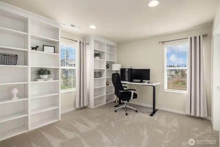 Third bedroom on the second floor with built-in cabinets is currently used as an office.