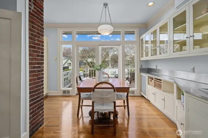 That opens onto the deck and lushly landscaped backyard