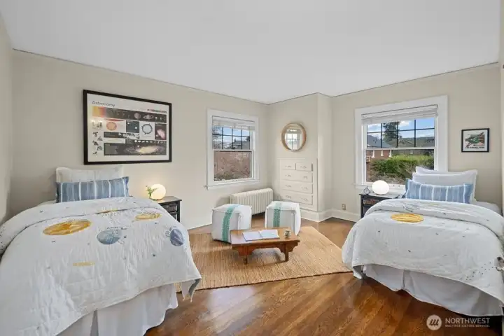 Bedroom three with windows facing east and north