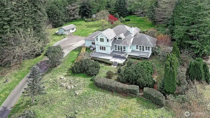 Perfect private setting with large home, multi decks facing west, Kohler generator by  the garage along with the heat pump.