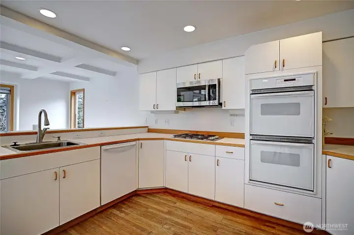 Roomy kitchen has snack bar and overlooks the dining room area.  Double ovens!