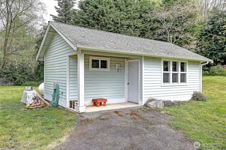 Shed/workshop for tools, putting around.  Separate building.  Notice propane tank (which is leased) peeking  from the back of the shed.