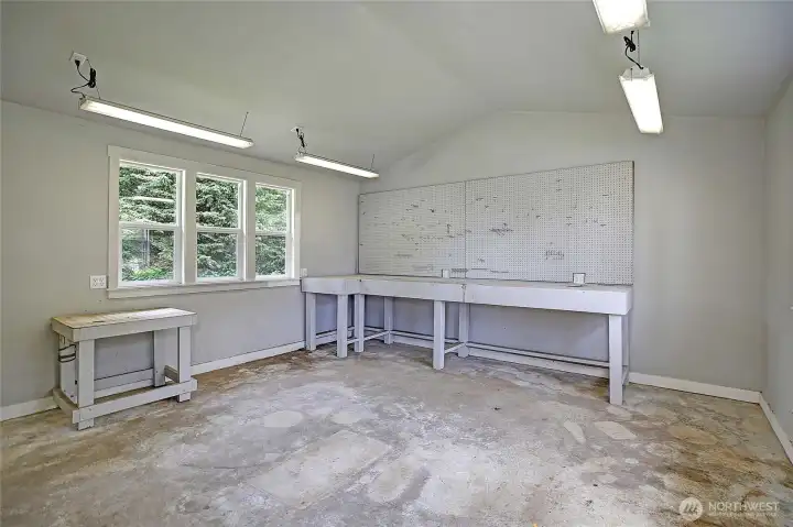 Inside shed/workspace, peg board, work benches ready for some fun!