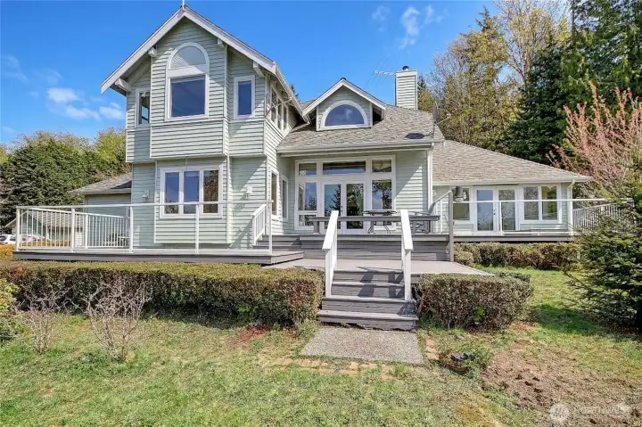 Deck faces west, multi level with bench.  Primary bedroom opens onto this deck.