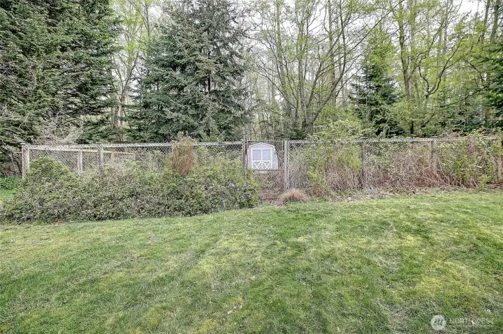 Fenced garden spot with small shed...This could be yours soon.  Plant some seeds and see what grows.