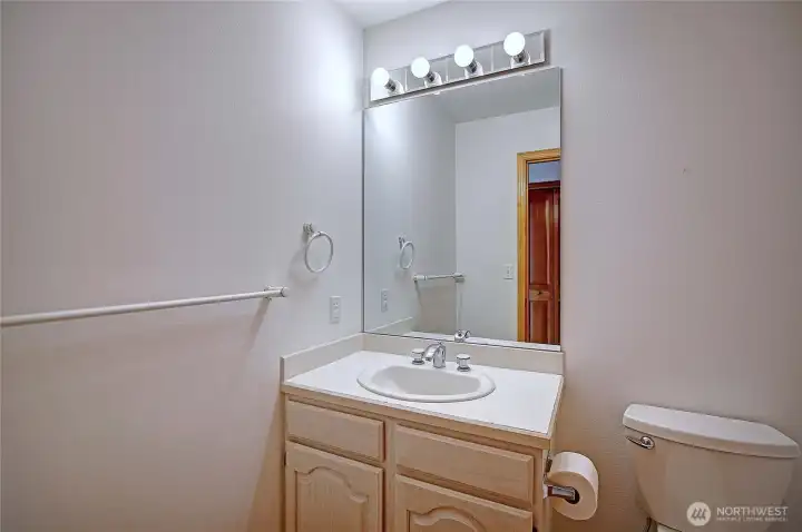 Half bath near garage and utility on main level.