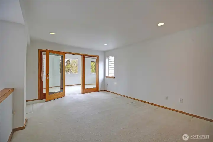 Upper floor loft area leading to the sunroom which faces west.